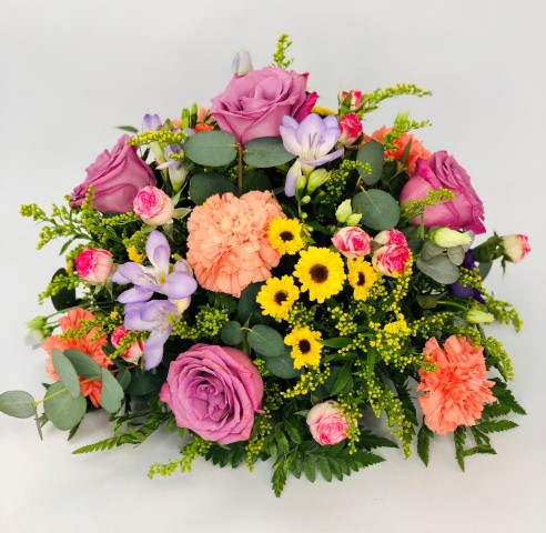 <h2>Vibrant Classic Posy | Funeral Flowers</h2>
<ul>
<li>Approximate Size W 25cm H 40cm</li>
<li>Hand created vibrant posy in fresh flowers</li>
<li>To give you the best we may occasionally need to make substitutes</li>
<li>Funeral Flowers will be delivered at least 2 hours before the funeral</li>
<li>For delivery area coverage see below</li>
</ul>
<h2><br />Liverpool Flower Delivery</h2>
<p>We have a wide selection of Funeral Posies offered for Liverpool Flower Delivery. Funeral posies can be provided for you in Liverpool, Merseyside and we can organize Funeral flower deliveries for you nationwide. Funeral Flower can be delivered to the Funeral directors or a house address. They can not be delivered to the crematorium or the church.</p>
<br>
<h2>Flower Delivery Coverage</h2>
<p>Our shop delivers funeral flowers to the following Liverpool postcodes L1 L2 L3 L4 L5 L6 L7 L8 L11 L12 L13 L14 L15 L16 L17 L18 L19 L24 L25 L26 L27 L36 L70 If your order is for an area outside of these we can organise delivery for you through our network of florists. We will ask them to make as close as possible to the image but because of the difference in stock and sundry items, it may not be exact.</p>
<br>
<h2>Liverpool Funeral Flowers | Posies</h2>
<p>This beautiful posy has been loving handcrafted by our florist. A classic selection in vibrant shades including large-headed roses, freesias, lisianthus and spray chrysanthemums presented in a posy design.</p>
<br>
<p>Funeral posies are suitable as funeral flowers and as tribute gifts to the bereaved family. The Funeral posy is flowers arranged in a circular shape. In the case of cremation, the family may like individual posies which can also be used as table decorations at the wake.</p>
<br>
<p>Contents of the Extra Large Posy:40cm Posy Pad, 5 Cerise Roses, 2 Cerise Spray Roses, 2 Purple Lisianthus, 4 Cerise Freesia, 5 Orange Carnations, 3 Yellow Spray Chrysanthemums, 3 Green Bupleurum and Yellow Solidago with mixed Foliage.</p>
<br>
<h2>Best Florist in Liverpool</h2>
<p>Trust Award-winning Liverpool Florist, Booker Flowers and Gifts, to deliver funeral flowers fitting for the occasion delivered in Liverpool, Merseyside and beyond. Our funeral flowers are handcrafted by our team of professional fully qualified who not only lovingly hand make our designs but hand-deliver them, ensuring all our customers are delighted with their flowers. Booker Flowers and Gifts your local Liverpool Flower shop.</p>
<p><br /><br /><br /></p>
<p><em>Vivian Hart - Review from Facebook - Funeral Flowers Liverpool</em></p>
<br>
<p><em>This 5 Star review was from Facebook - Booker Flowers and Gifts - Reviews Facebook</em></p>
<br>
<p><em>Visited Booker Flowers as my usual florist was closed. Ordered funeral flowers. The advice and customer service we were given was excellent. The flowers exceeded our expectations - will be using Booker Flowers in the future - Thank you</em></p>
<br>
